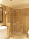 Custom made frameless glass shower enclosure. Purpose made sink units