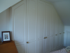 Cupboards built into eaves in loft conversion