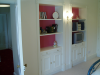 Cupboards and shelves built into alcoves.