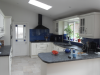 Kitchen extension. Velux roof lanterns for light. Feature glass splash backs