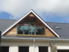 Close up of feature balcony with wood cladding.